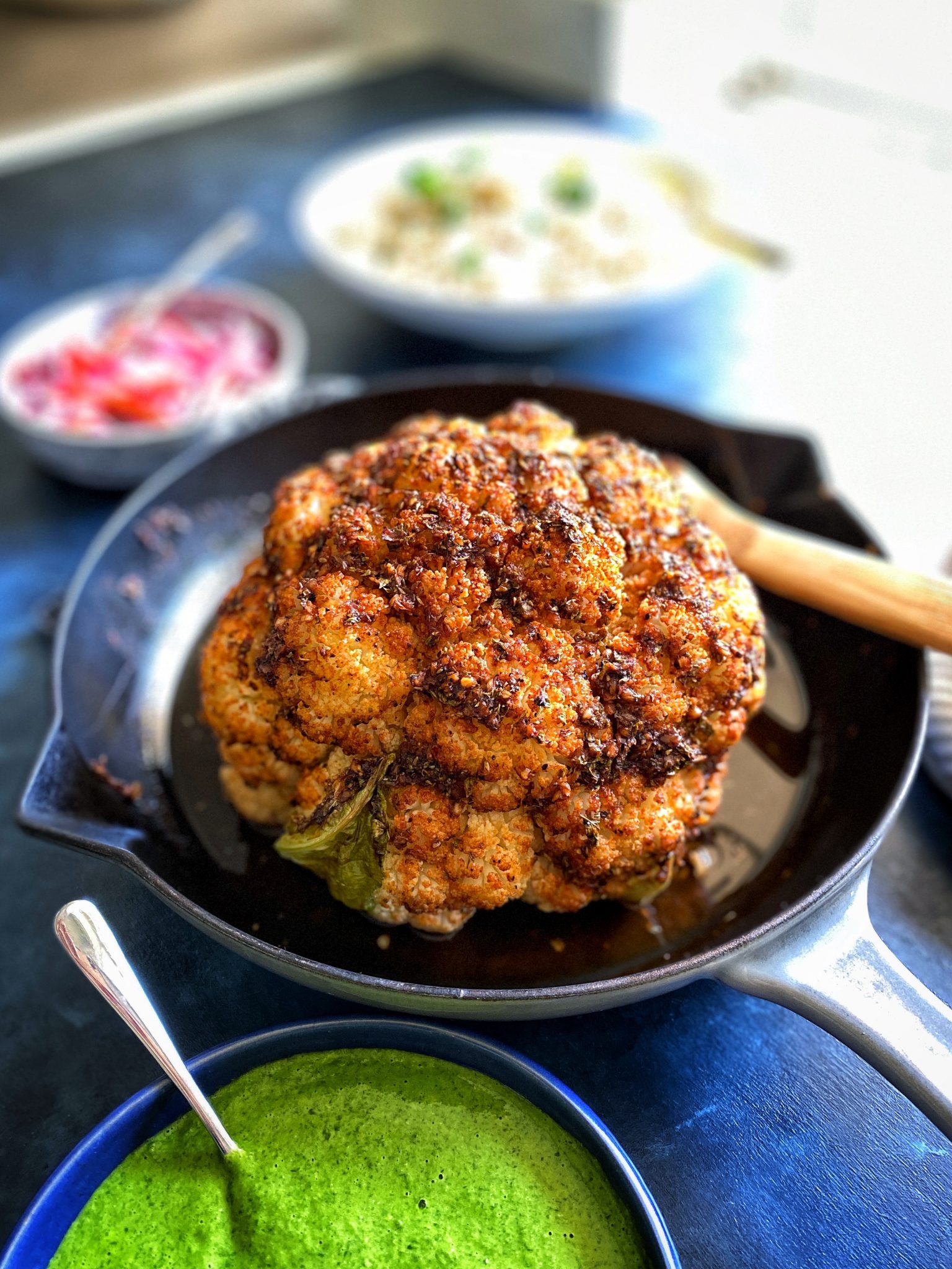 https://celebfrance.org/wp-content/uploads/2025/12/wholeroastedcauliflowerhead-castironpan-scaled.jpg